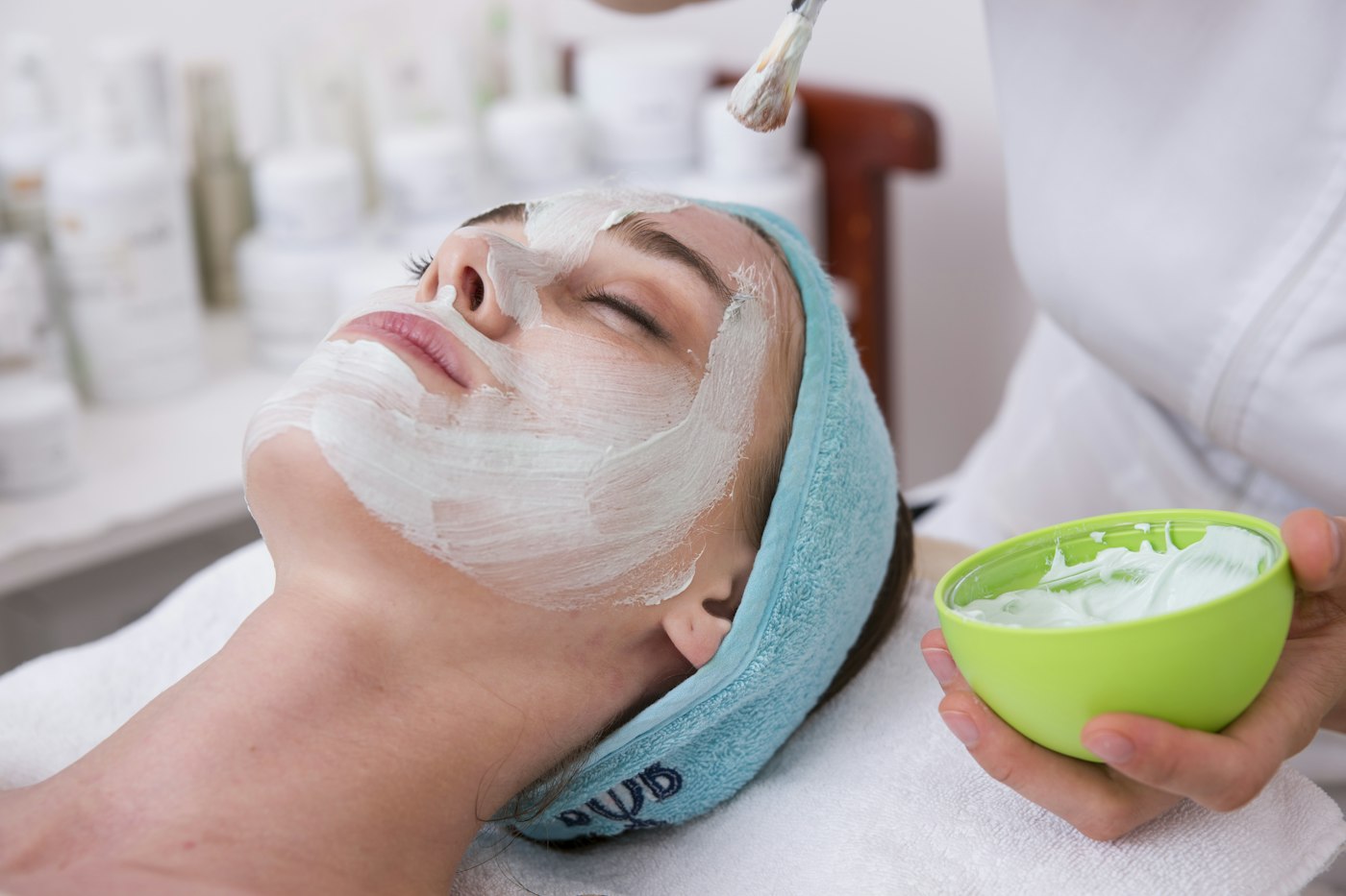 Woman relaxing with a face mask during a DIY spa day