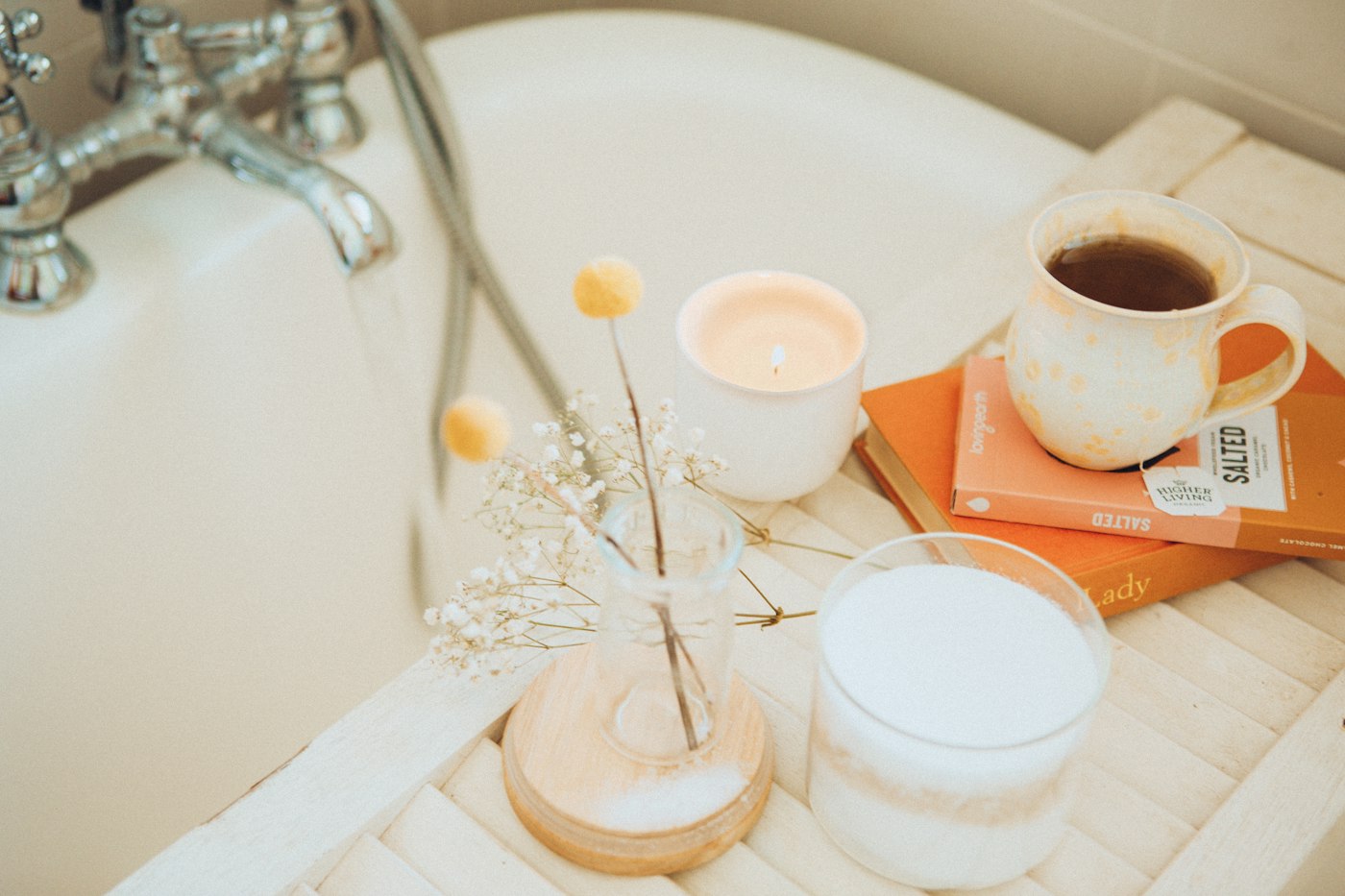 Coffee and books by the bathtub, a self-care homebody gift idea
