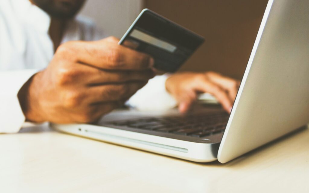 Shopping online with a laptop and card