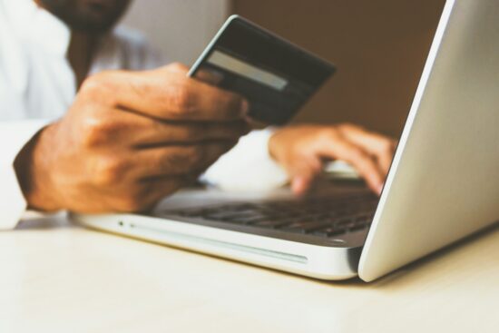 Shopping online with a laptop and card